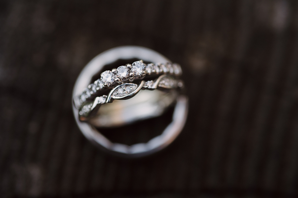 detail image of bride's engagement and wedding bands
