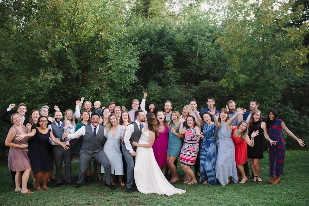 large fun group photo at camp wedding