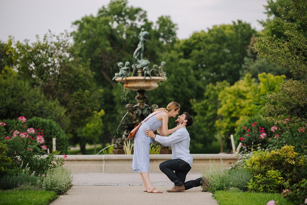 surprise proposal in minneapolis garden by fountain