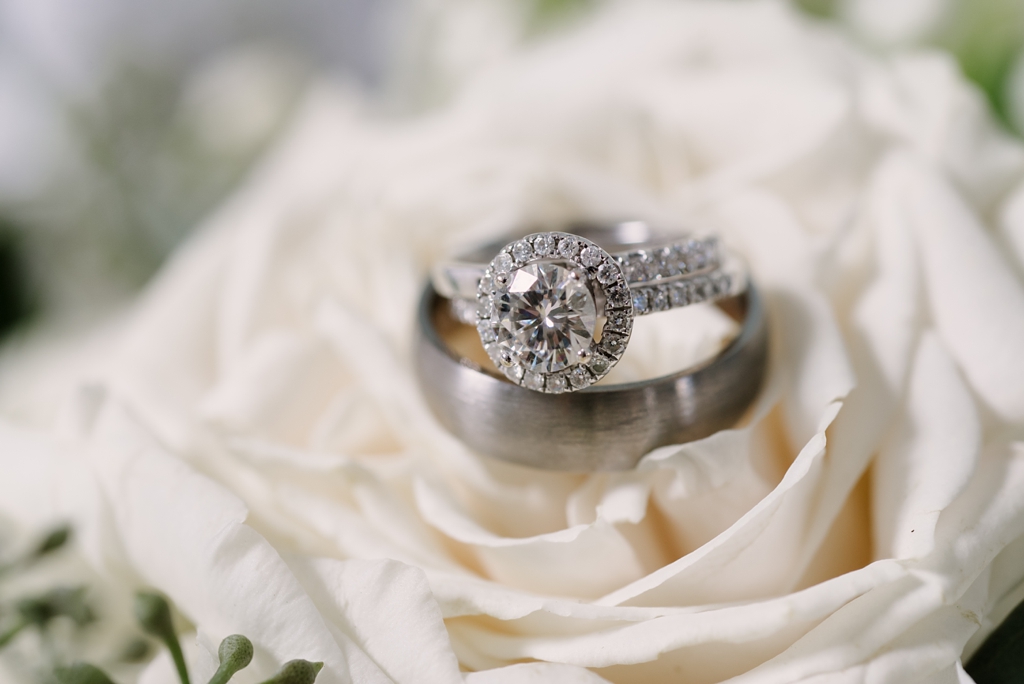 wedding ring detail on white rose