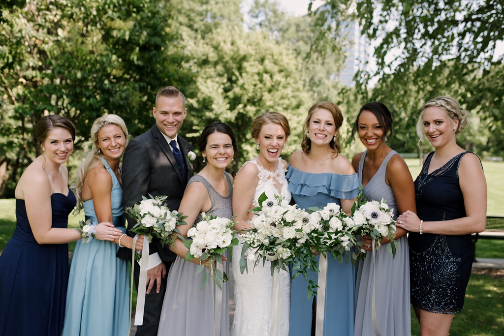 bridal party with bouquets outdoor