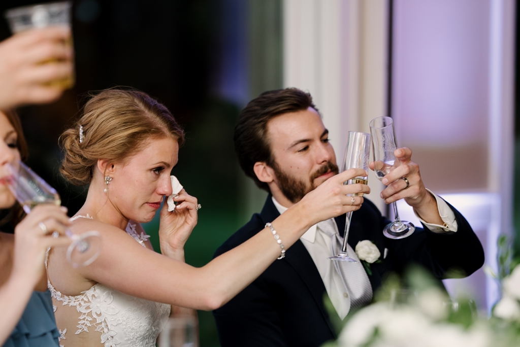 bride toasts groom during speeches