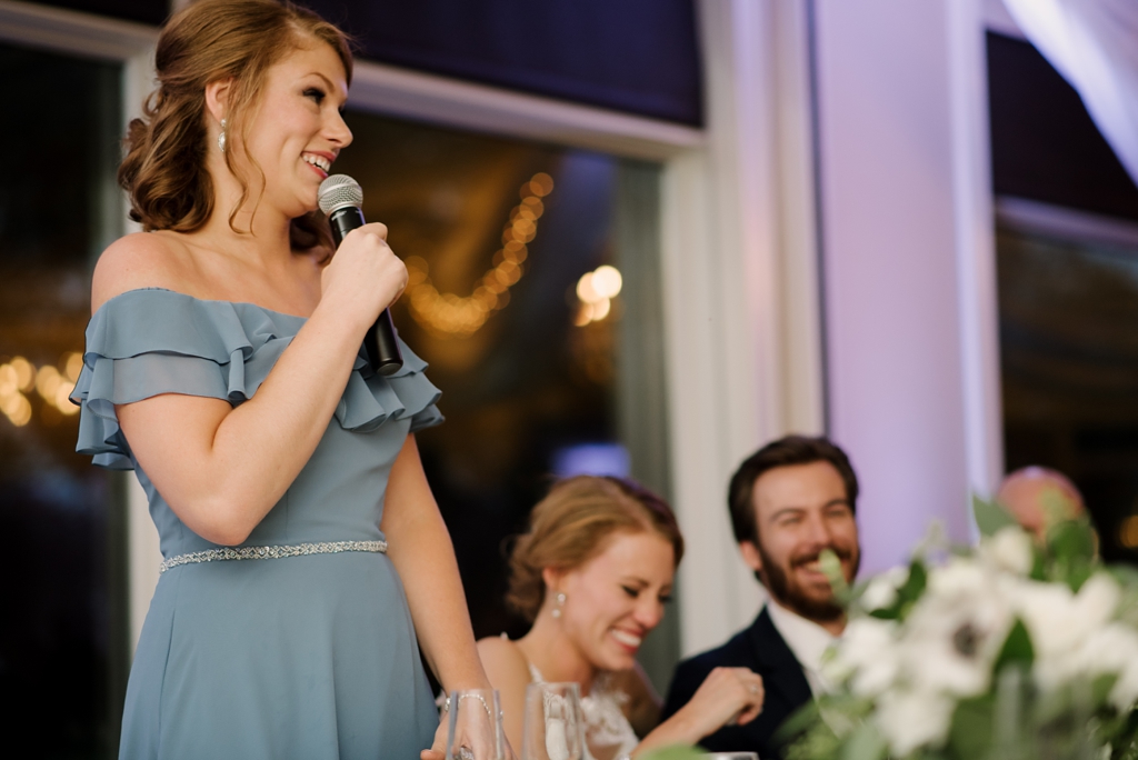 bridesmaid telling funny story about bride