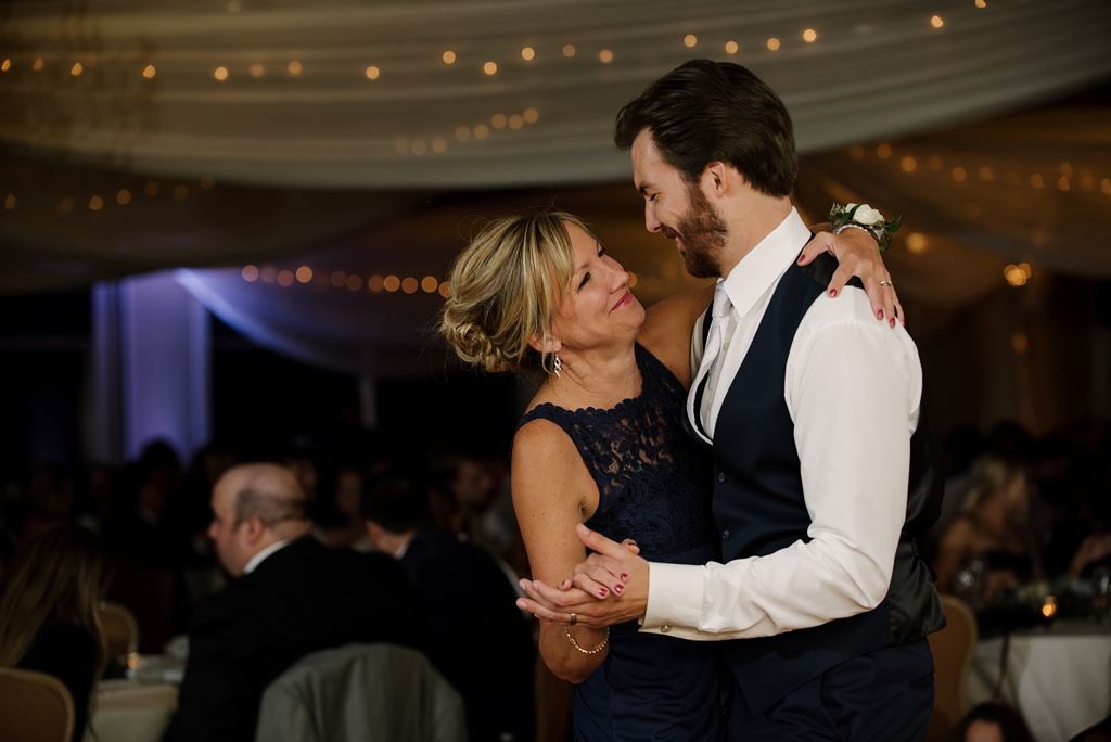 groom dancing with mom at reception