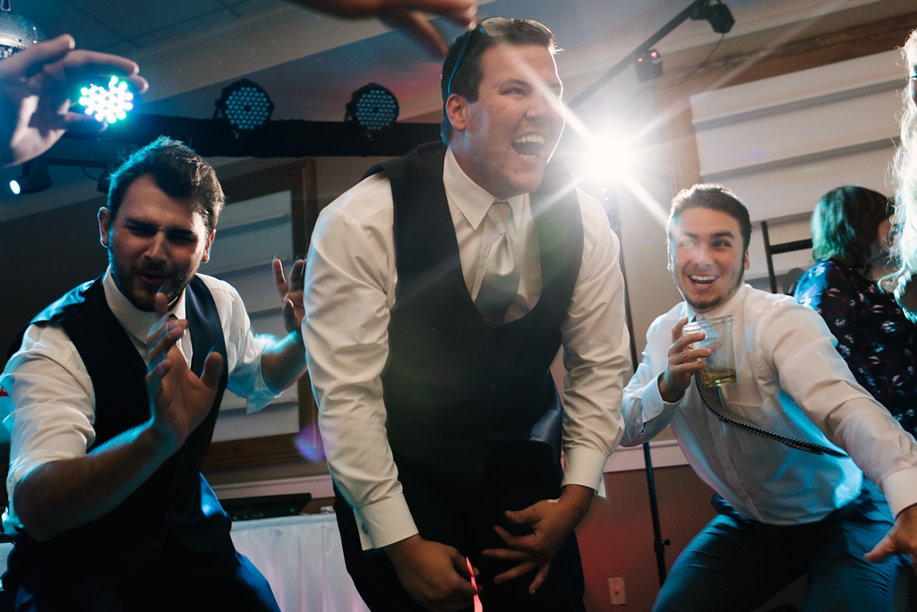 groomsmen dance at reception