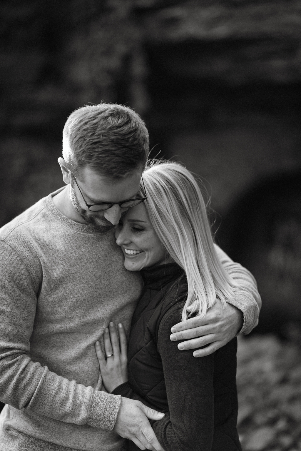black and white image engagement session couple embracing