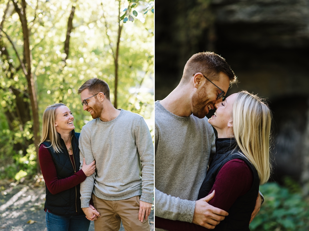 couple walk together and embrace at engagement session