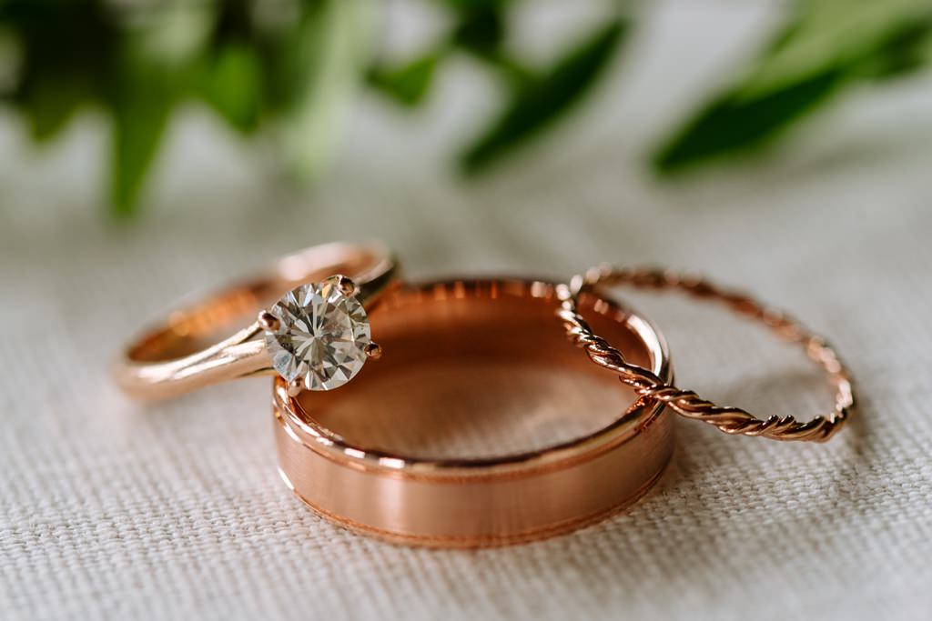 detail of copper toned wedding and engagement bands