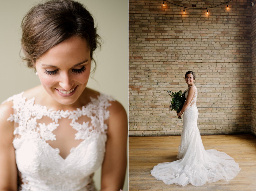 bride looking down and smiling; bride in empty room with bouquet and string lights
