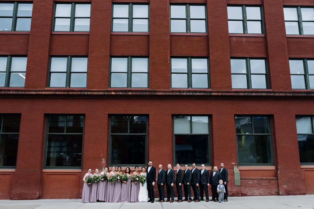 wedding party in front of brick building downtown minneapolis