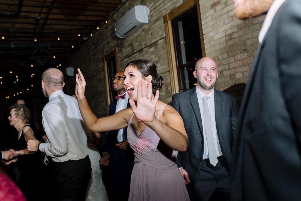 wedding guests dance at day block event center minneapolis