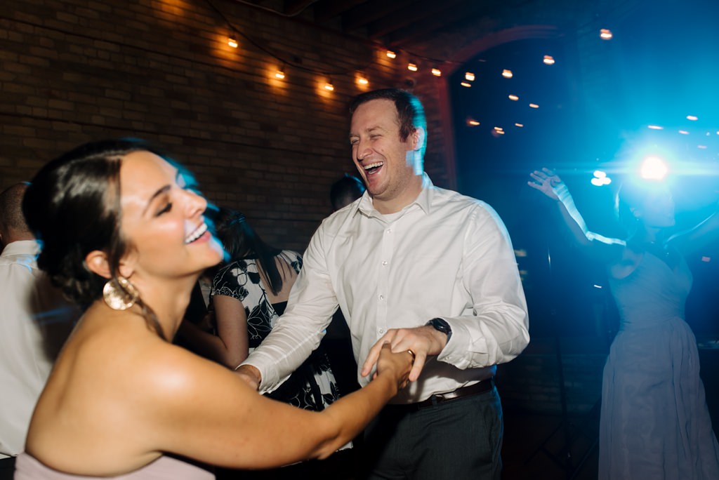 wedding guests dance at day block reception
