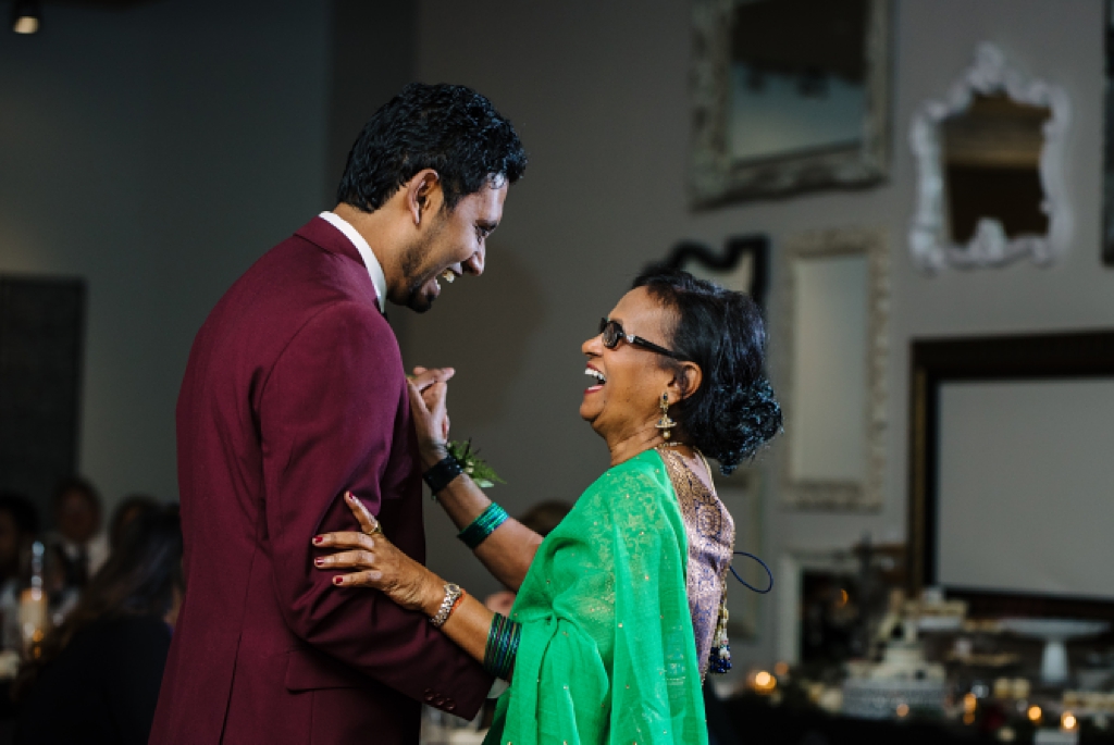 groom dances with mother at wedding reception