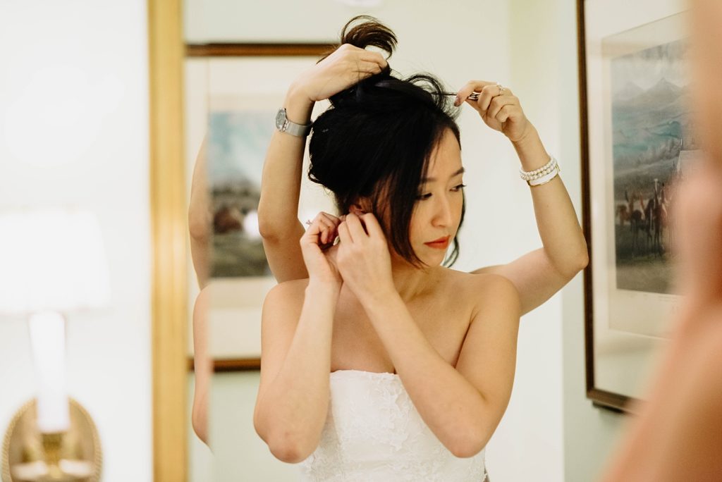 bride gets her hair done for minneapolis club wedding