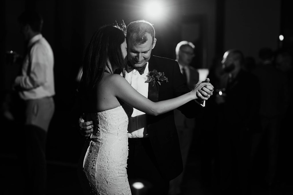 bride and groom dance at minnapolis club reception