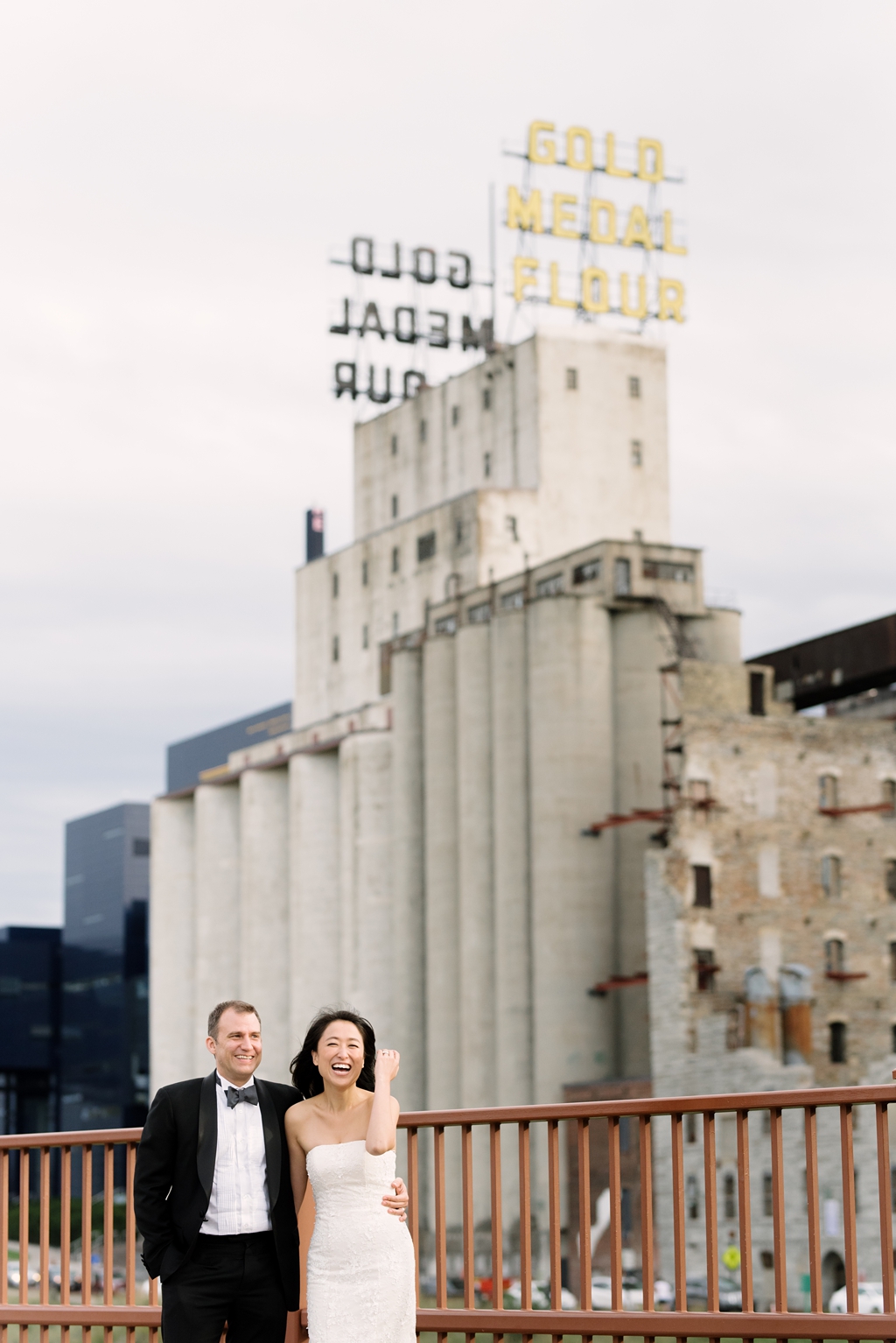 bride and groom in gold medal park downtown minneapolis
