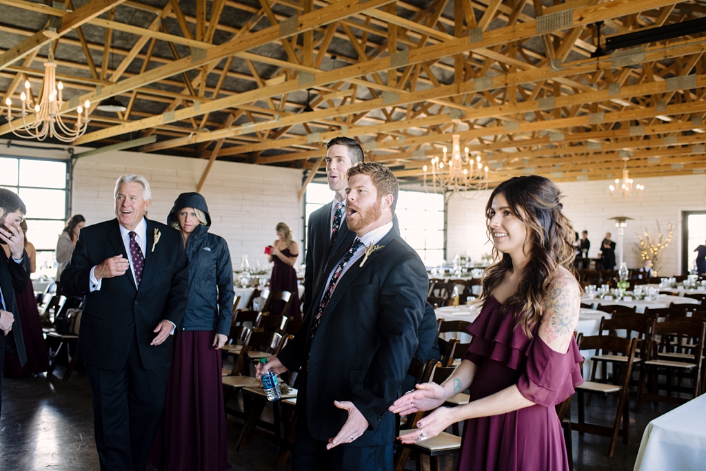 wedding party reacts to first look at bride's dress