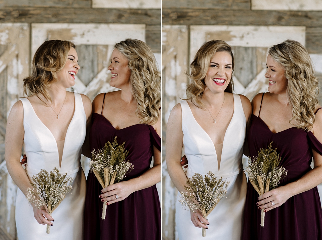 bride laughs and smiles with bridesmaid