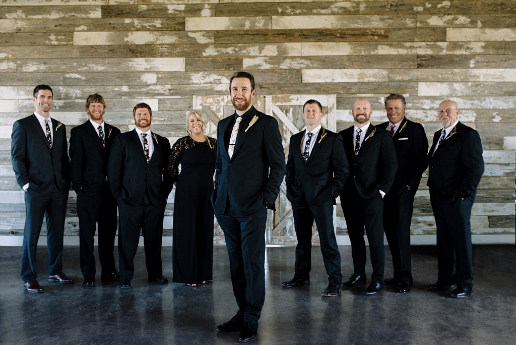groom with wedding party at serenity hills venue minnesota