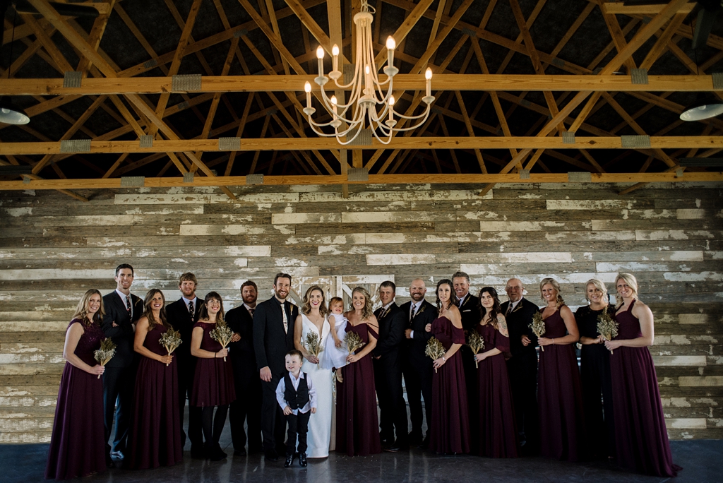 elegant and rustic bridal party with chandelier in minnesota