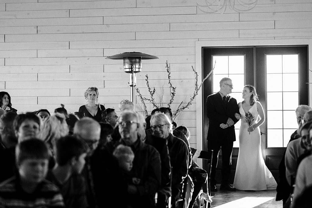 bride and father prepare to walk down aisle at serenity hills wedding