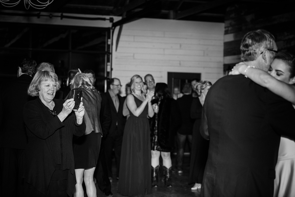wedding guests watch first dance at minnesota reception