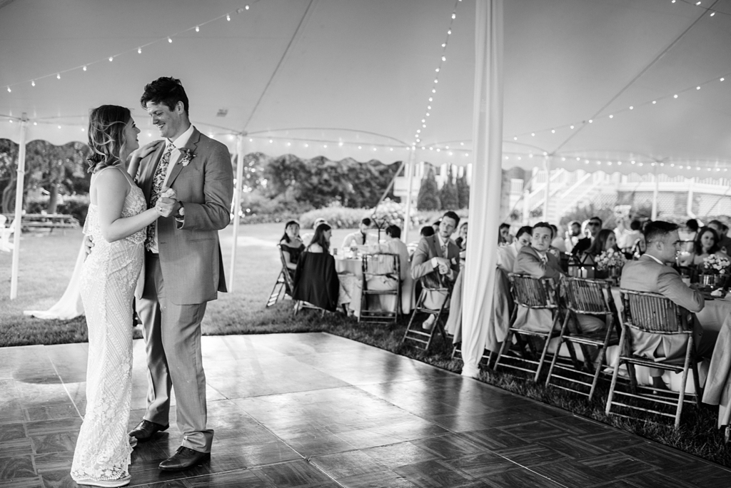 bride and groom first dance at backyard wedding reception