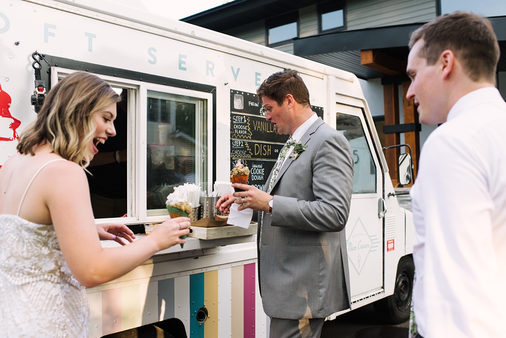bride and groom get ice cream at food truck