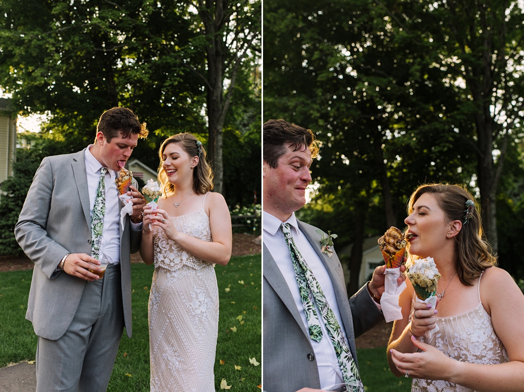 newlyweds share ice cream at backyard wedding reception