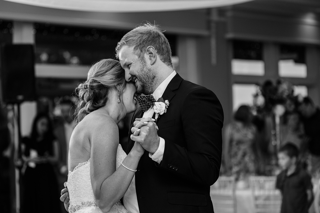 black and white image newlyweds dancing at reception