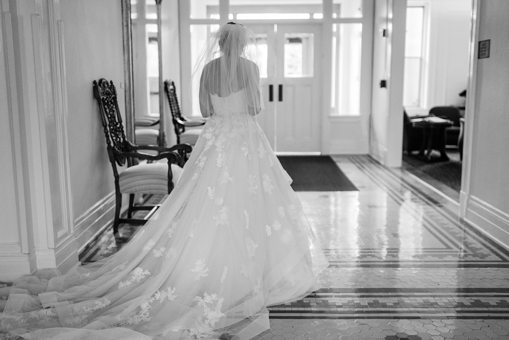 bride walking down hall with long train