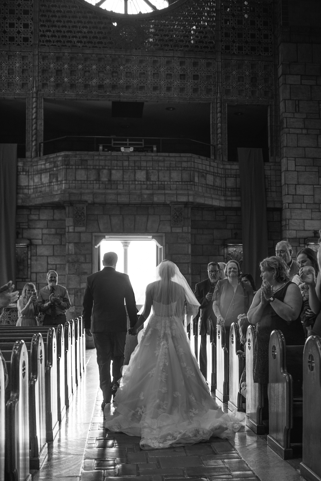 newlyweds leaving chapel after wedding ceremony