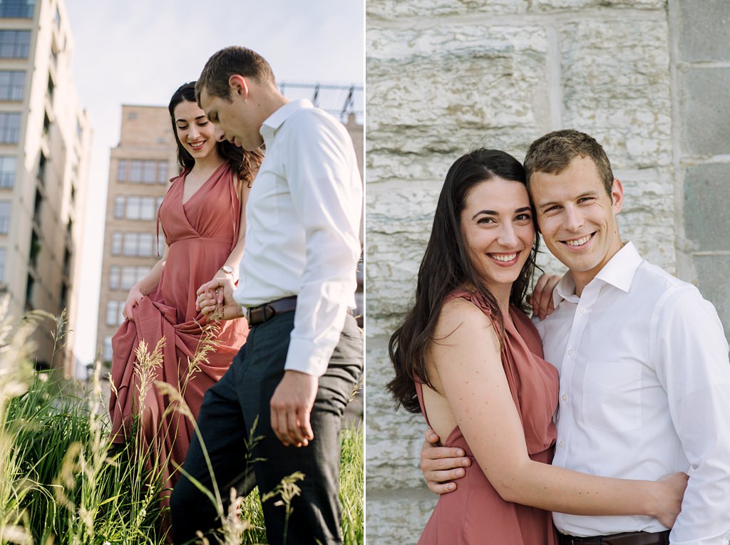 mill city park engagement session, smiling couple in front of brick wall
