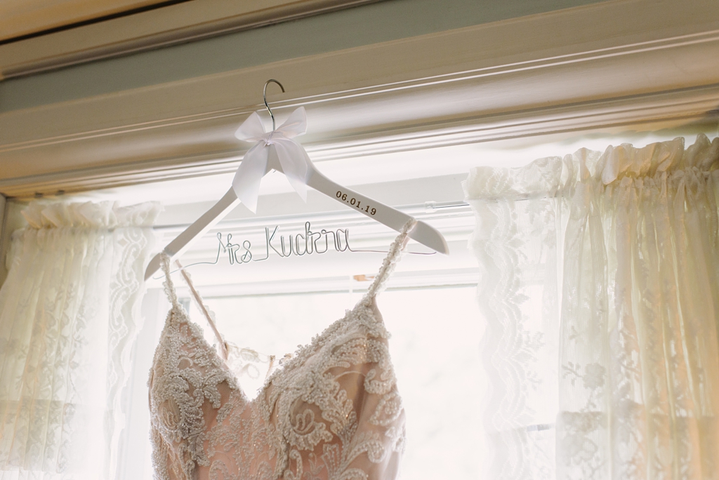 detail of bride's dress and hanger