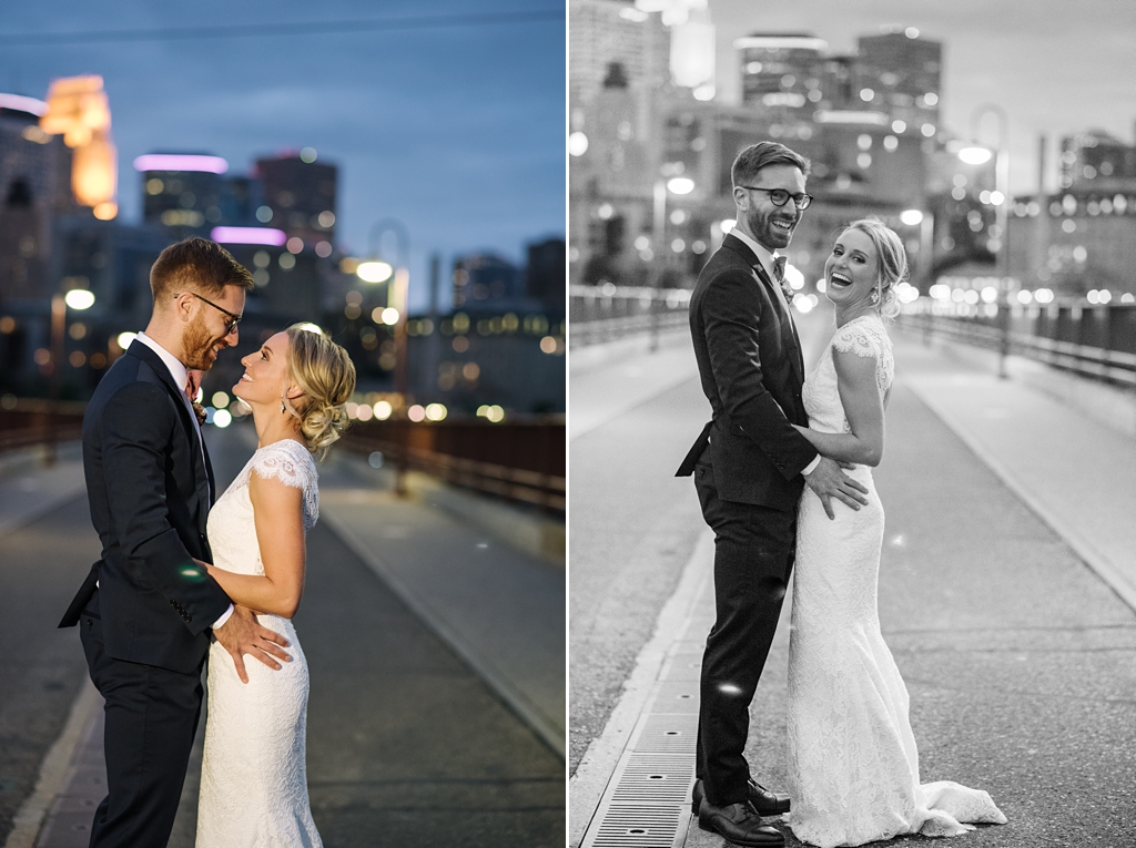 newlyweds on stone arch bridge in front of minneapolis skyline at dusk