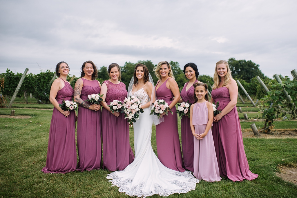 bride with bridesmaids and flowergirl at winery wedding