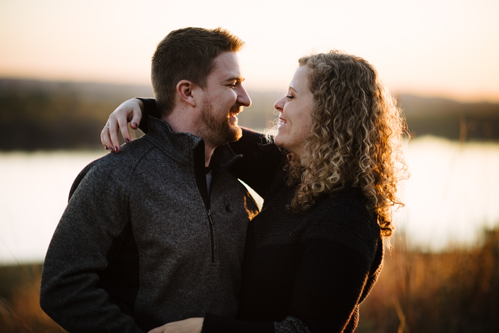 couple laughing with sunset light 