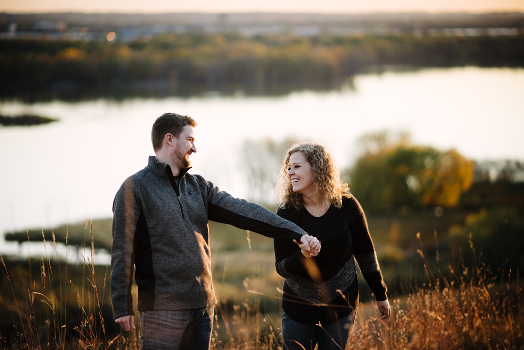 couple being playful during their fall engagement photos