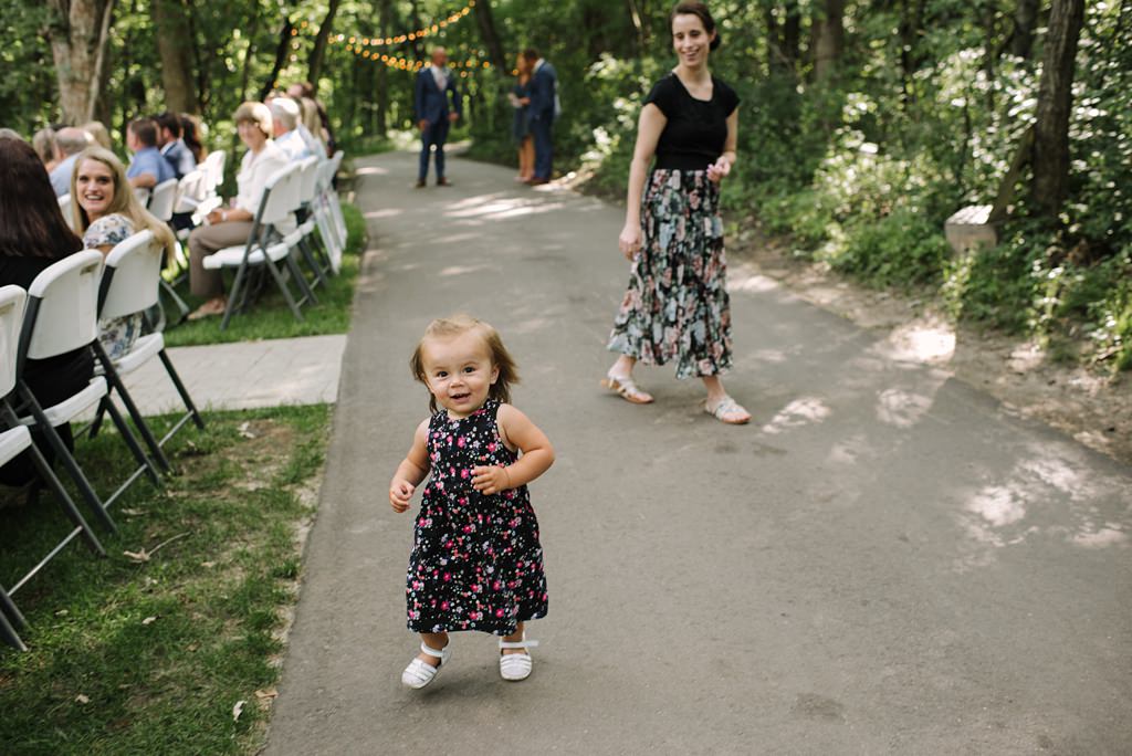toddler wedding guest walking toward camera