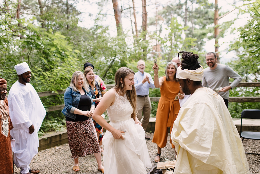 wedding party throws money at bride and groom during traditional ceremony