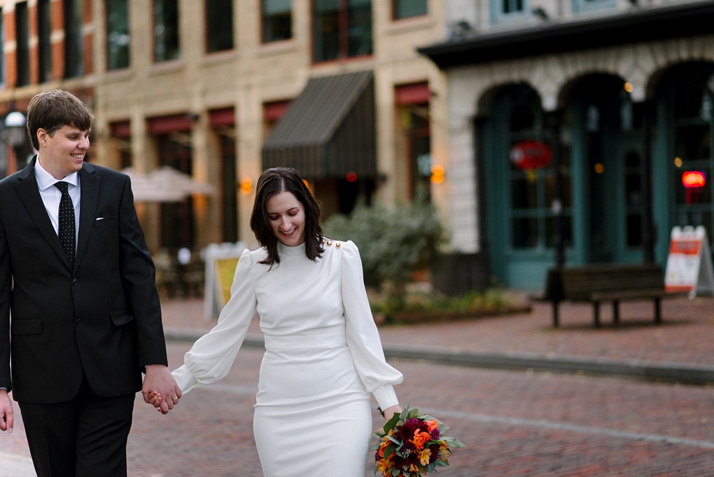 bride and groom hold hands after their minneapolis elopement ceremony