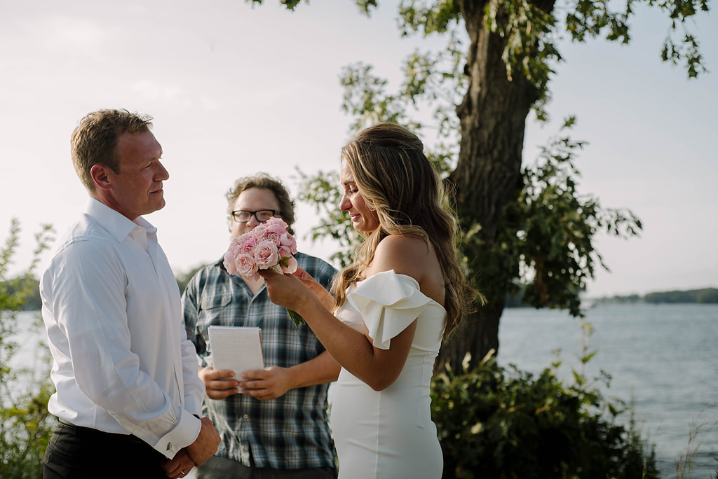 tearful bride and groom exchange lakeside vows