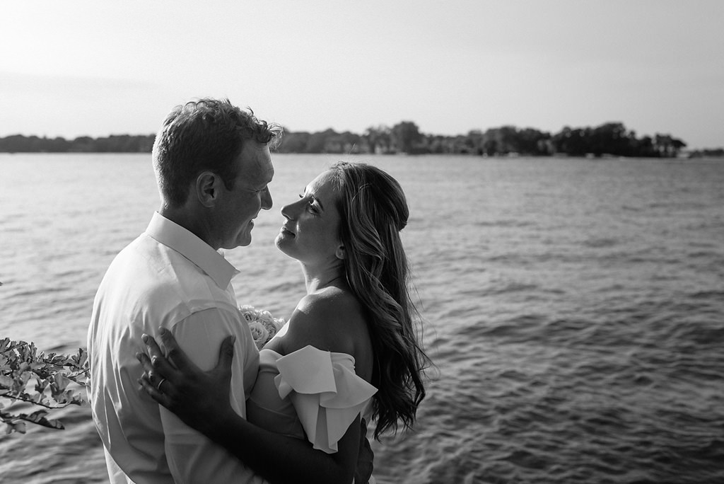 intimate newlywed portrait beside lake