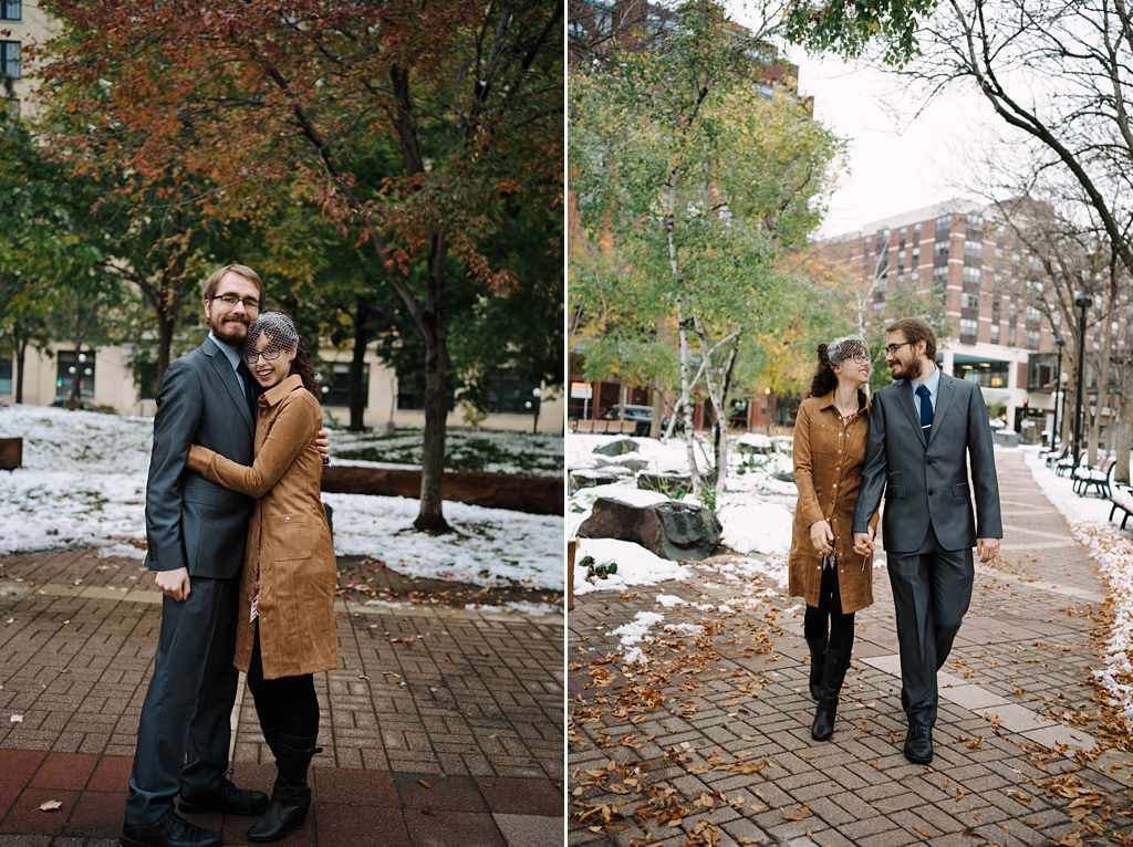 newlyweds walking through park in winter
