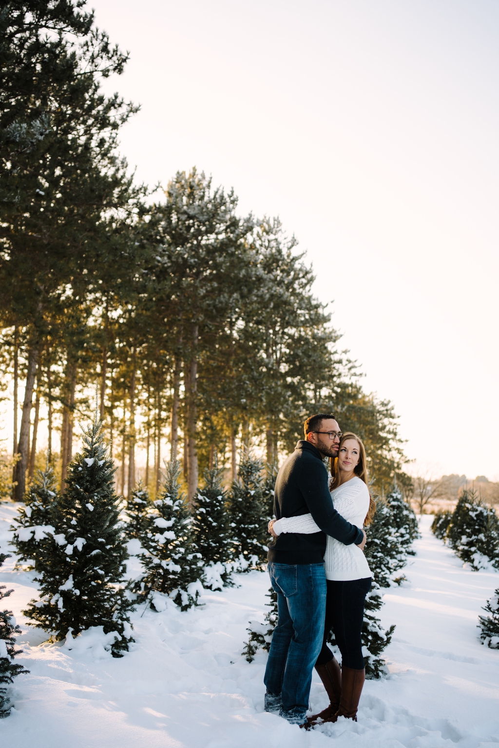 sunset engagement session couple with pine trees