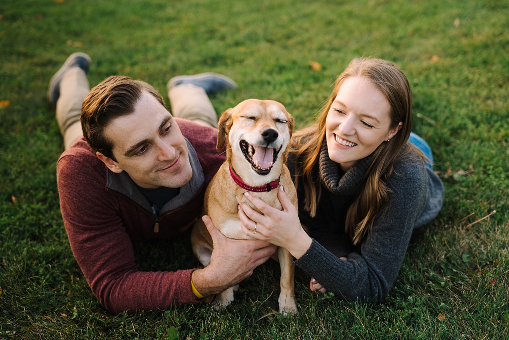 engaged couple with their dog