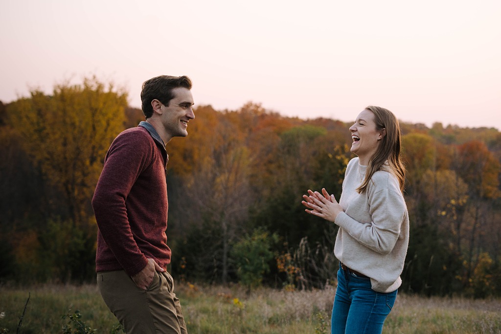 couple joking during fall engagement session