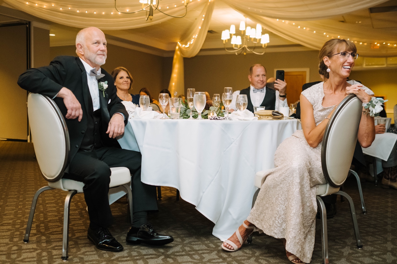 guests listening to speeches at minnesota valley country club wedding reception