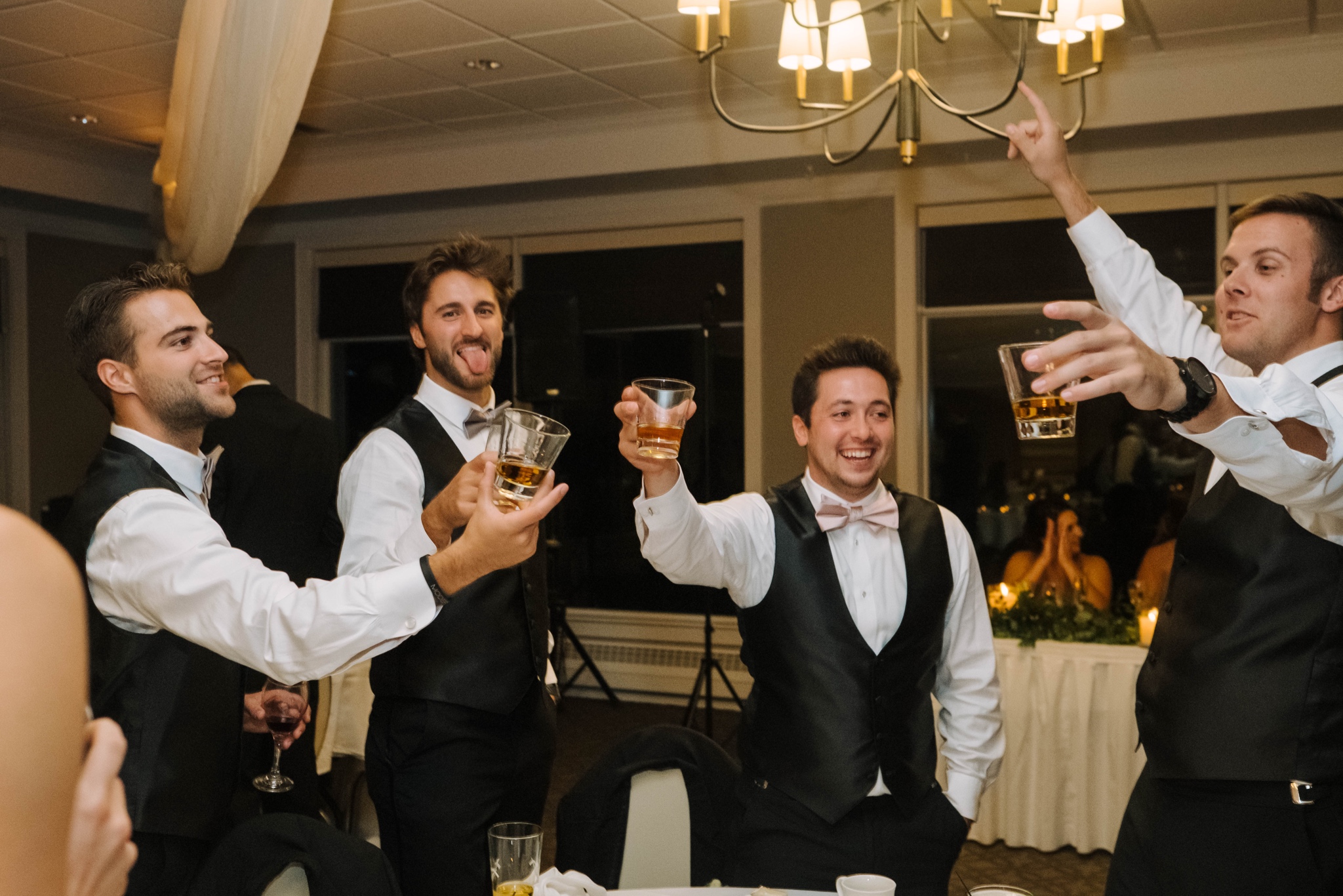 groomsmen toasting at wedding reception