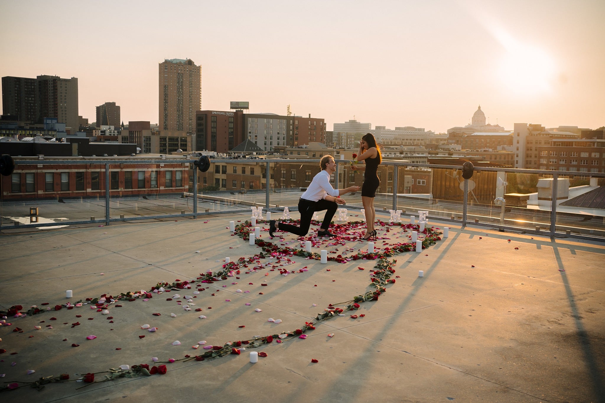 sunset proposal on building rooftop in st paul